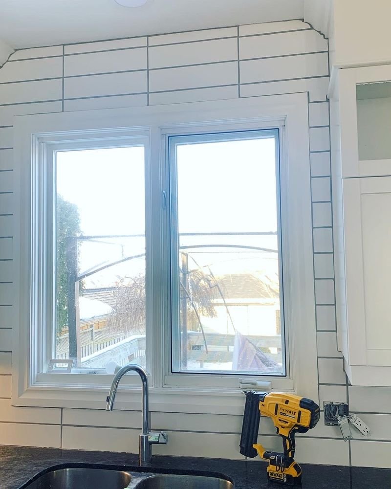 Kitchen renovation in progress: a shiplap wall and new window trim above the sink, by Elm Kitchen