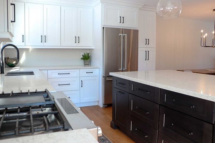 Two-tone kitchen with a dark island, Two-tone cabinets by Canada Kitchens