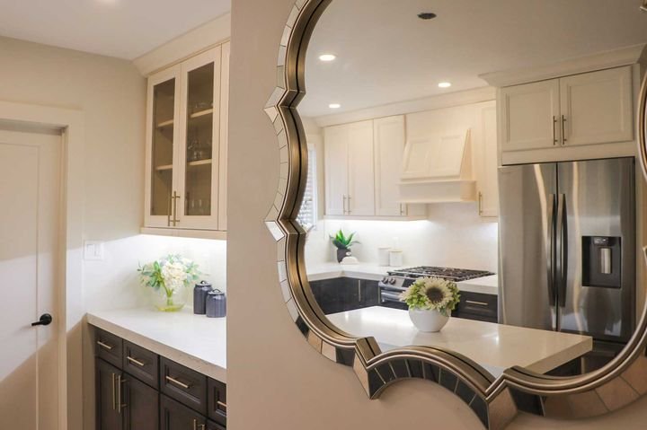 Two-tone kitchen reflected in a mirror, Two-tone cabinets by Canada Kitchens