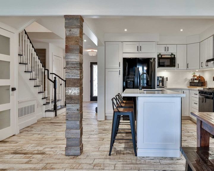 Kitchen with a reclaimed-wood pillar, Canada Kitchens cabinets