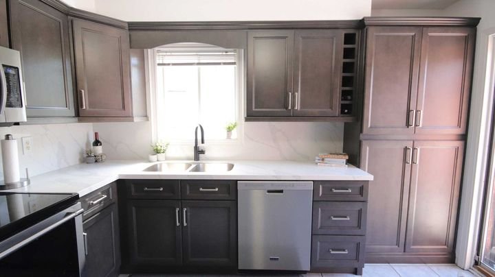 Kitchen with the sink under a window, Canada Kitchens cabinets
