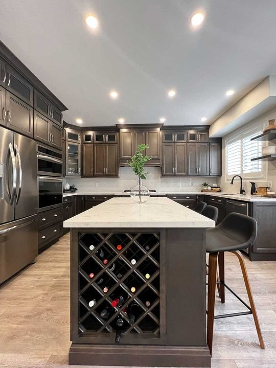Island with a built-in wine rack, London Grey cabinets by Canada Kitchens