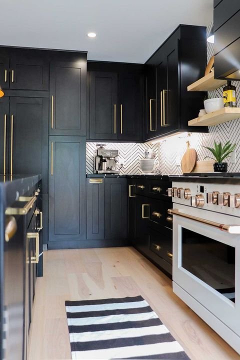Range wall with a dark hood, Shaker Charcoal cabinets by Canada Kitchens