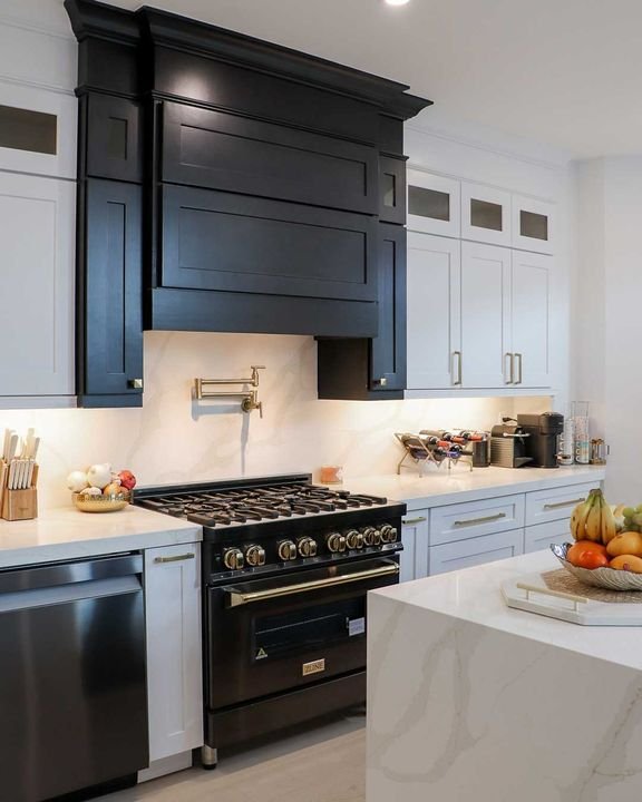 Wood range hood in the cabinet finish, Shaker Charcoal cabinets by Canada Kitchens