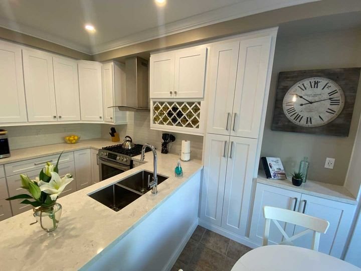 Peninsula and wine rack, Shaker White cabinets by Canada Kitchens