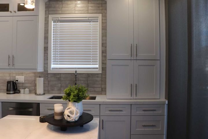 Stacked upper cabinets, Shaker White cabinets by Canada Kitchens