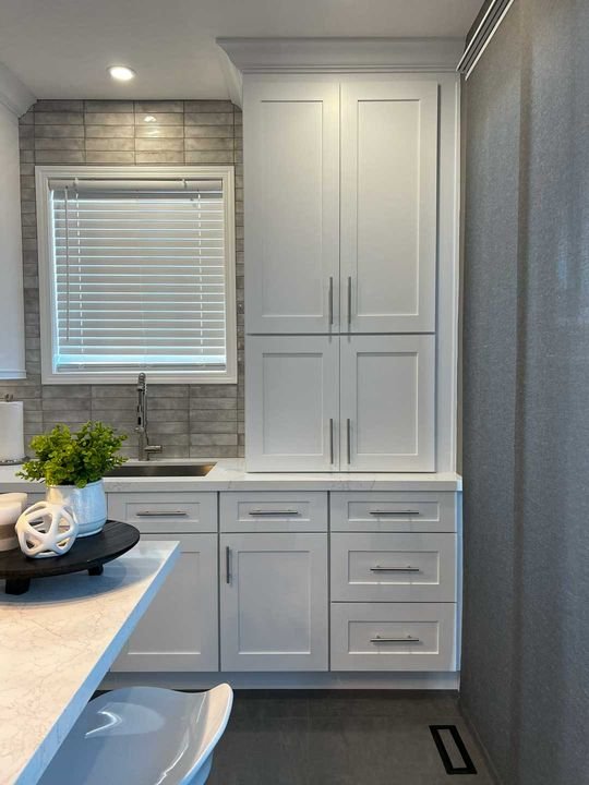 Stacked upper cabinets, Shaker White cabinets by Canada Kitchens
